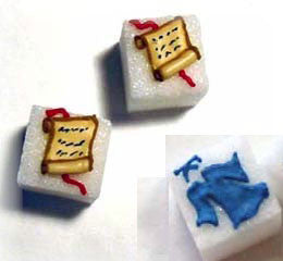 Decorated sugar cubes including graduation gowns and diplomas