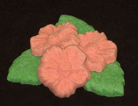 Tea sugars shaped like hibiscus flowers and leaves